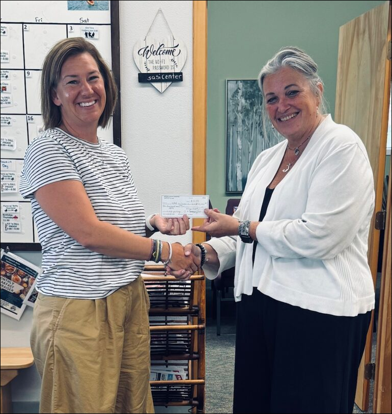 Emma kevercamp from rotary donatin 2024 outline Emma Kevercamp from Rotary Club presenting donation to SASi